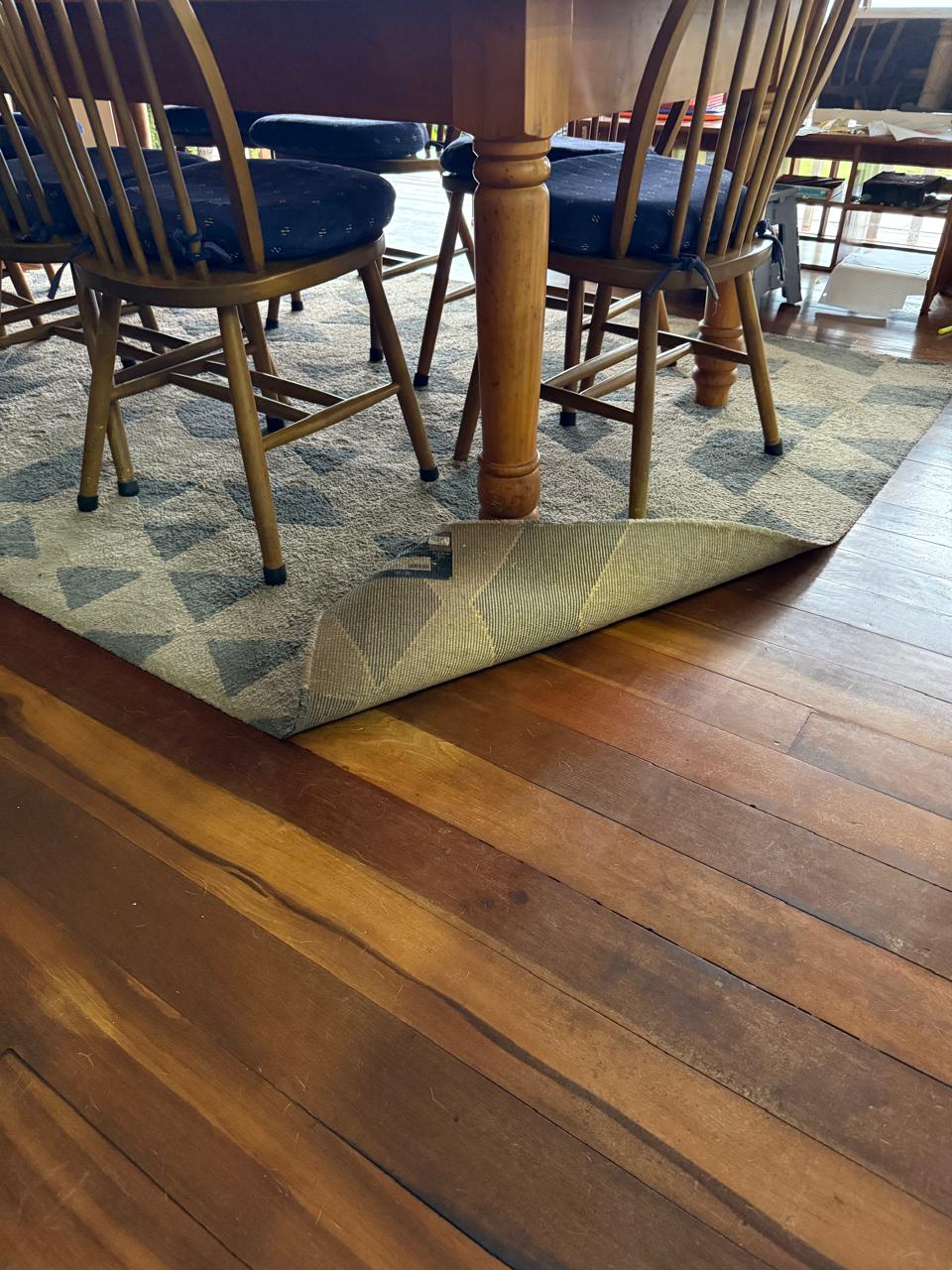 Elegant dining room with secured area rug